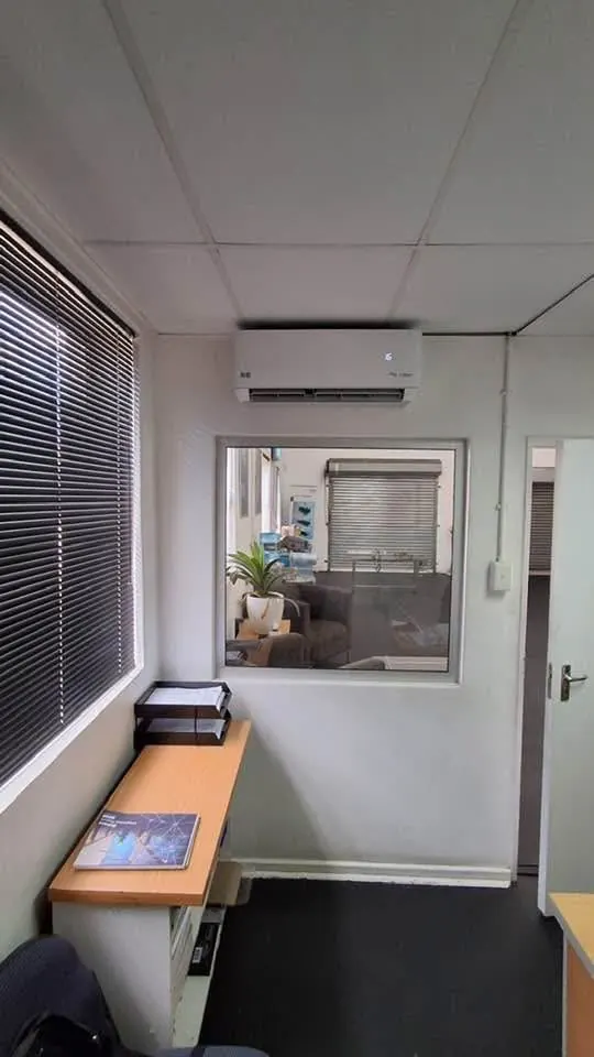 Aircon indoor unit mounted below the ceiling in an office